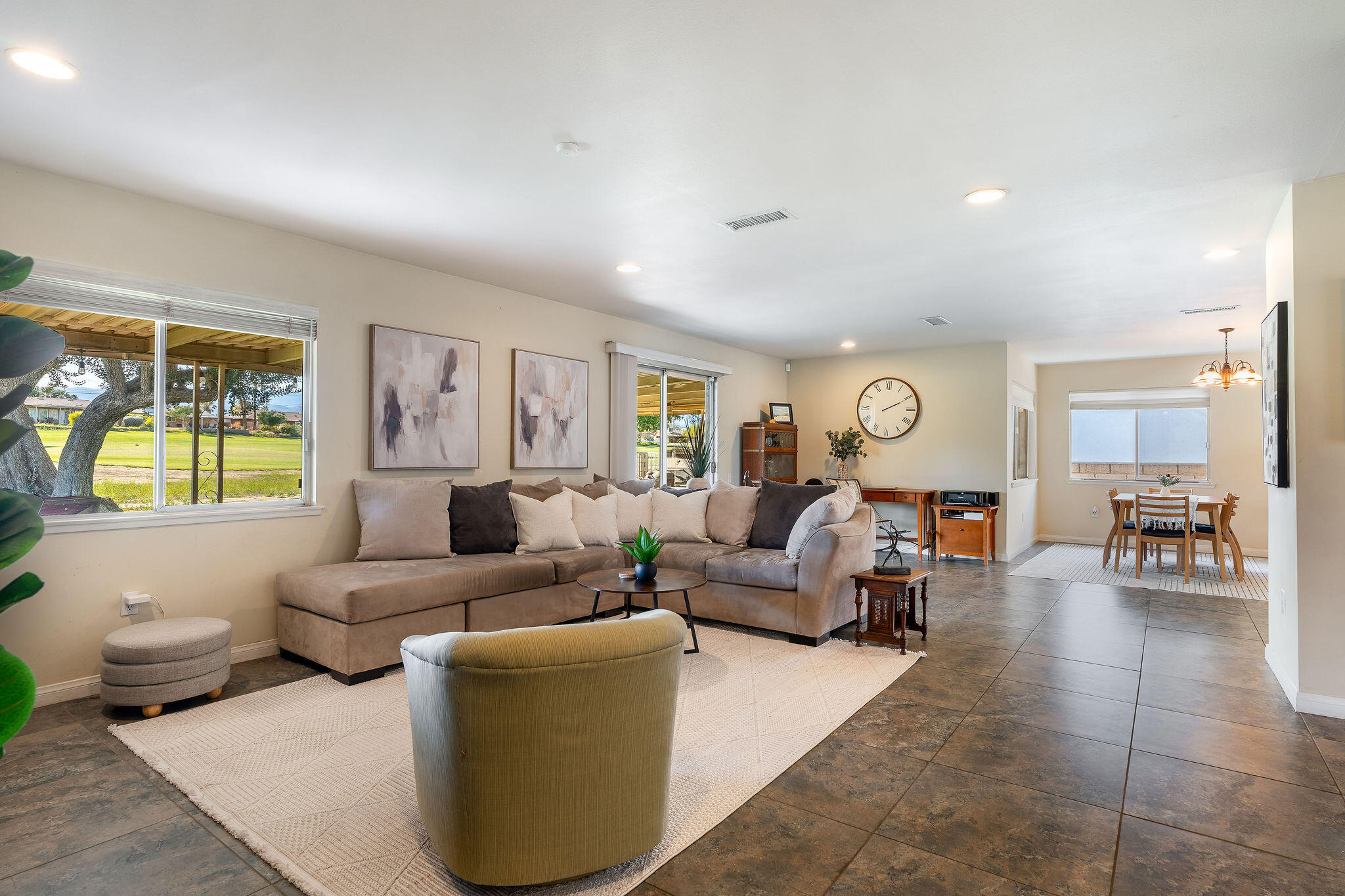 42735 Kansas Street Palm Desert, CA 92211 - Photo 10 of 48 a living room with furniture and a large window