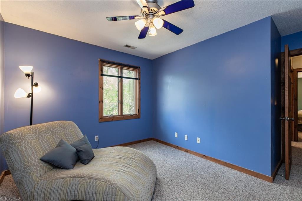 426 Farmstead Road Winston-Salem, NC 27107 - Photo 21 of 48 The primary bedroom features a vaulted wood ceiling and doors onto the deck