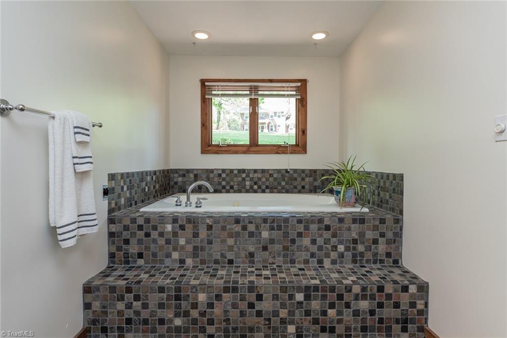 426 Farmstead Road Winston-Salem, NC 27107 - Photo 25 of 48 A jetted tub is in the primary bathroom