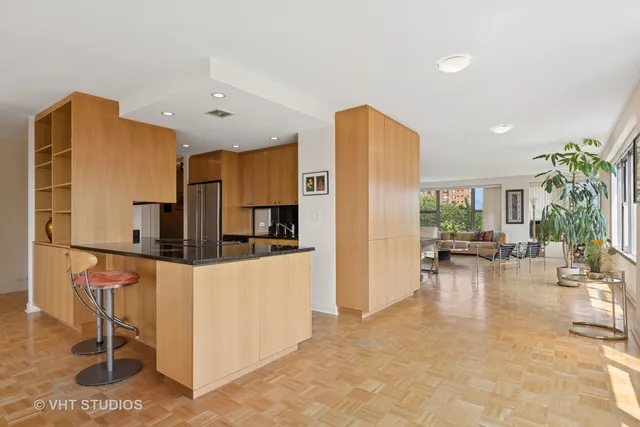 a kitchen with stainless steel appliances a refrigerator and a stove top oven