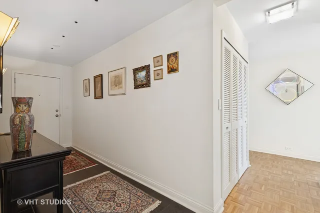 a room with a chair and white walls