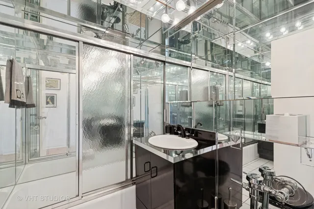 a bathroom with a sink and mirror