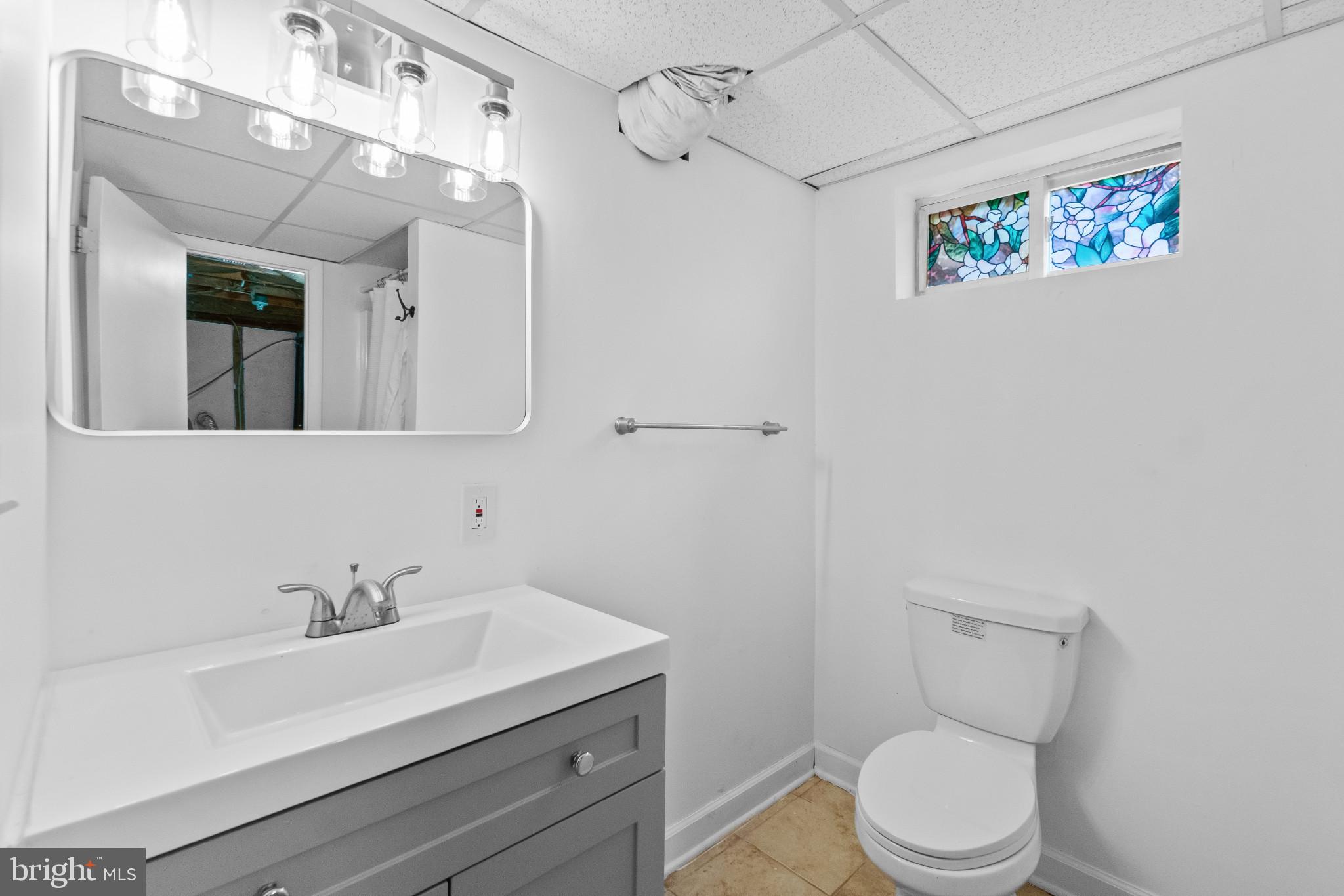 981 Westway Annapolis, MD 21409 - Photo 23 of 38 a bathroom with a sink mirror vanity and toilet