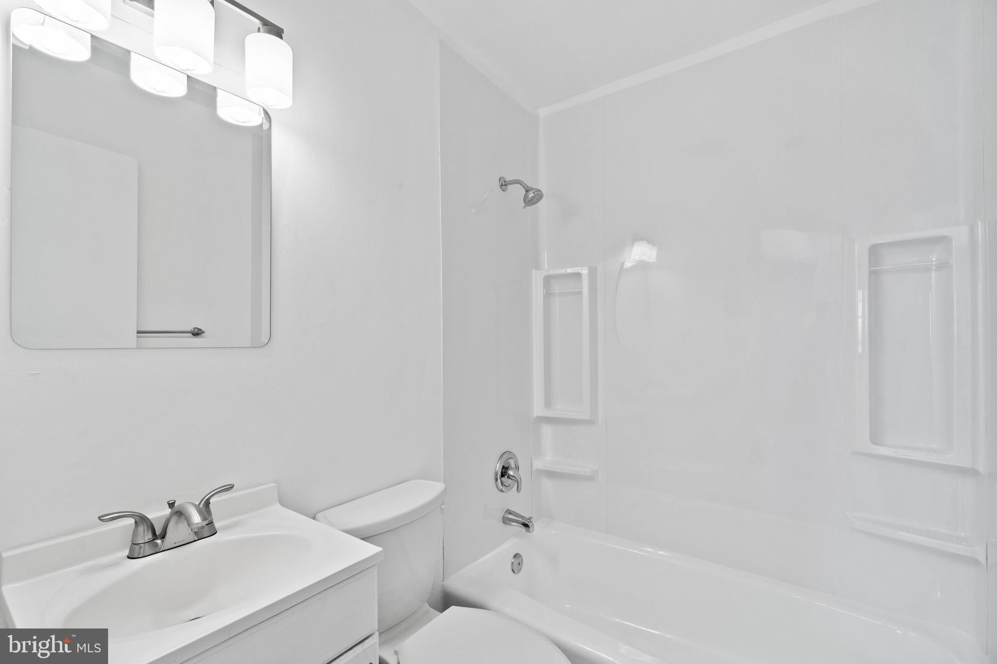 981 Westway Annapolis, MD 21409 - Photo 28 of 38 a white bath tub sitting next to a white sink and vanity