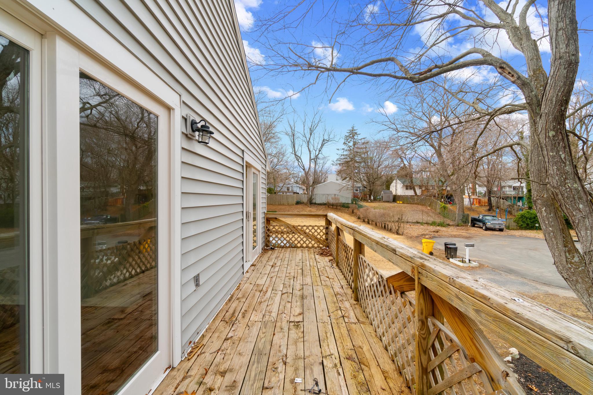 981 Westway Annapolis, MD 21409 - Photo 36 of 38 a view of a balcony with wooden floor and large trees