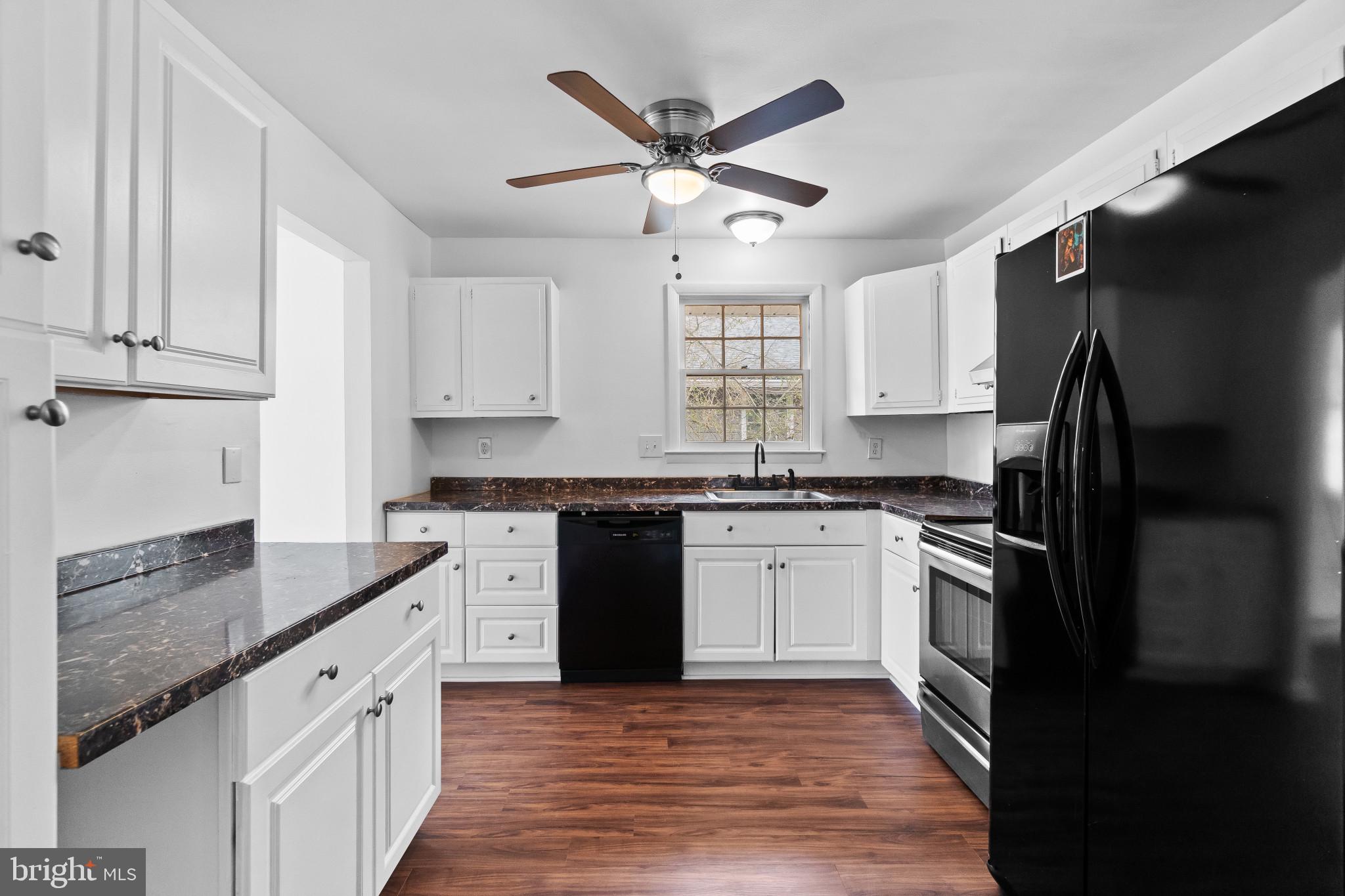 981 Westway Annapolis, MD 21409 - Photo 9 of 38 a kitchen with granite countertop a sink stainless steel appliances and window
