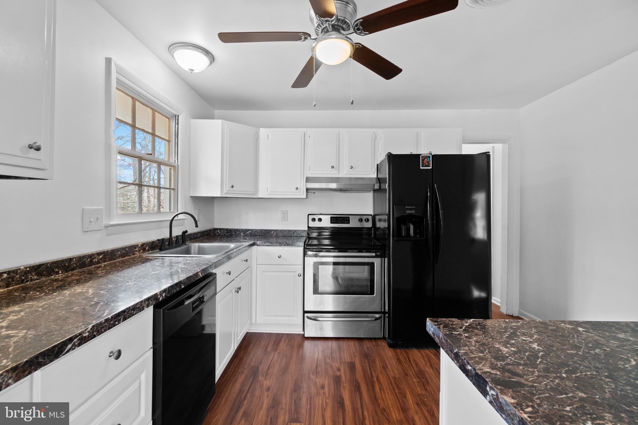 981 Westway Annapolis, MD 21409 - Photo 10 of 38 a kitchen with a stove a sink and a refrigerator