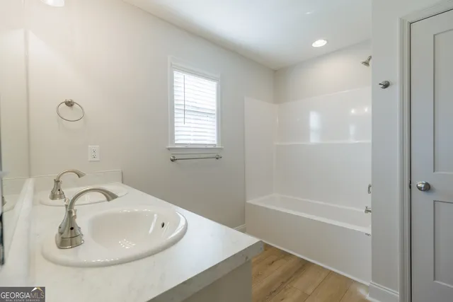 a bathroom with a sink and a bathtub