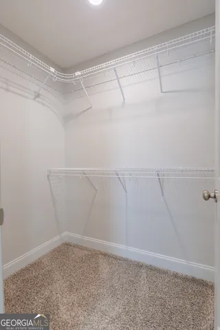 a view of an empty walk in closet
