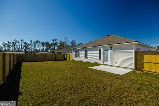 a big house with pool in front of it