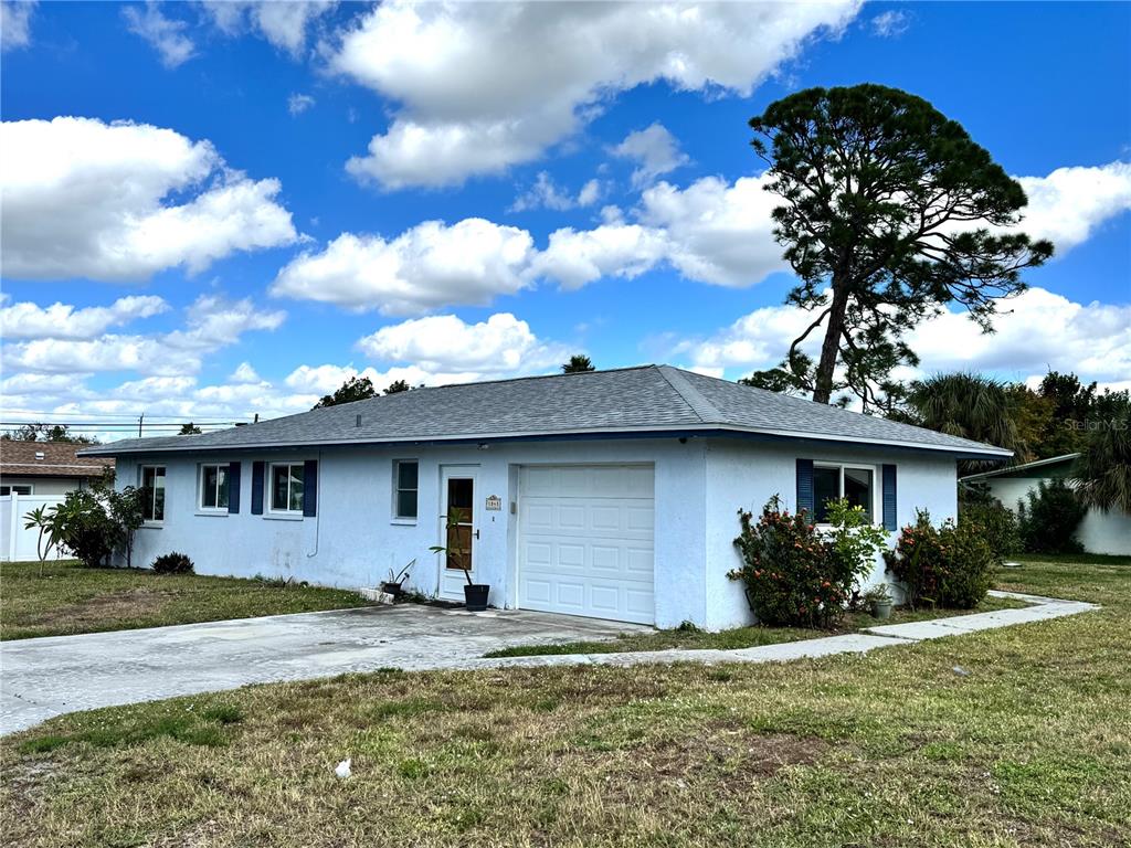 1048 Porpoise Road Venice, FL 34293 - Photo 24 of 26 a front view of a house with garden