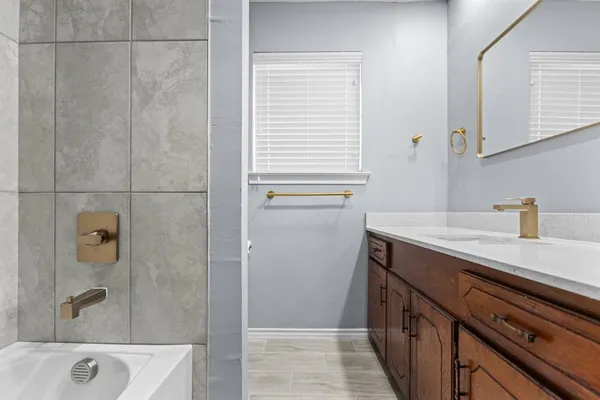 a bathroom with a sink and a bathtub