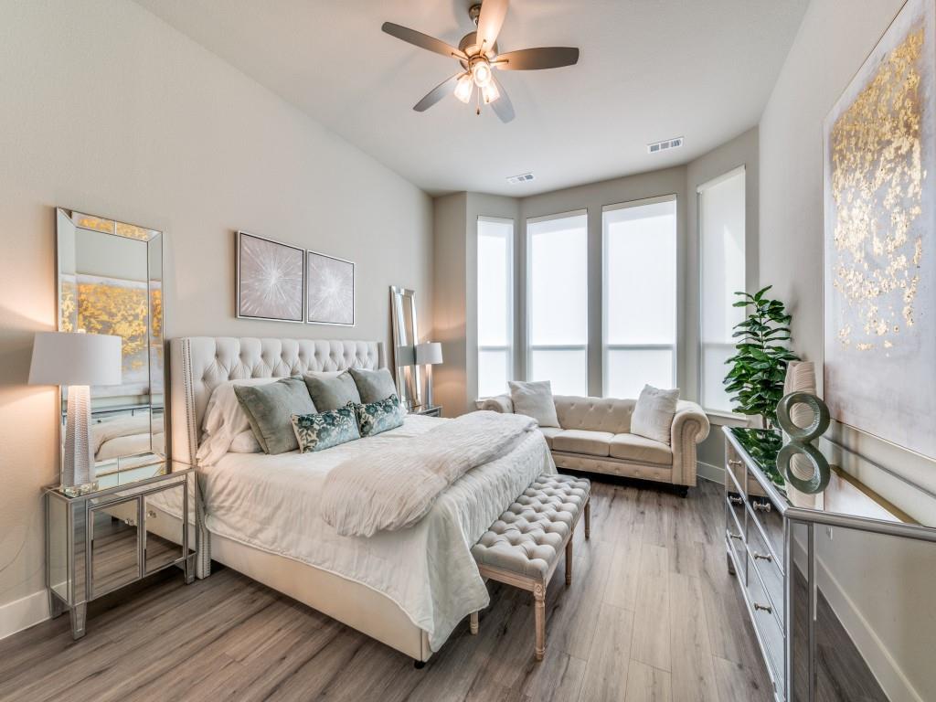 2724 Eccleston Street Celina, TX 75009 - Photo 14 of 29 a bedroom with a bed and a couch