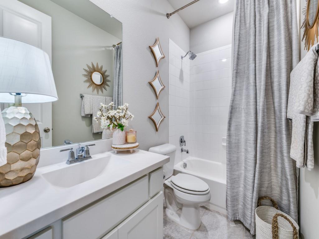 2724 Eccleston Street Celina, TX 75009 - Photo 18 of 29 a bathroom with a sink a toilet and shower