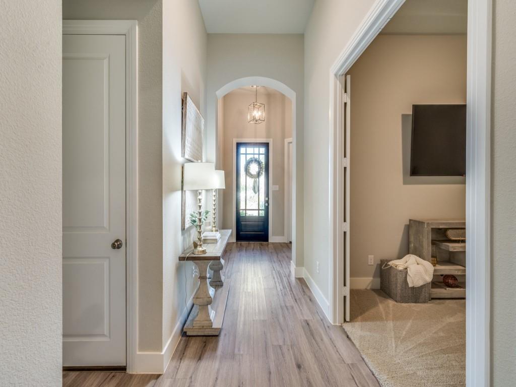 2724 Eccleston Street Celina, TX 75009 - Photo 3 of 29 a view of a hallway with wooden floor windows and livingroom