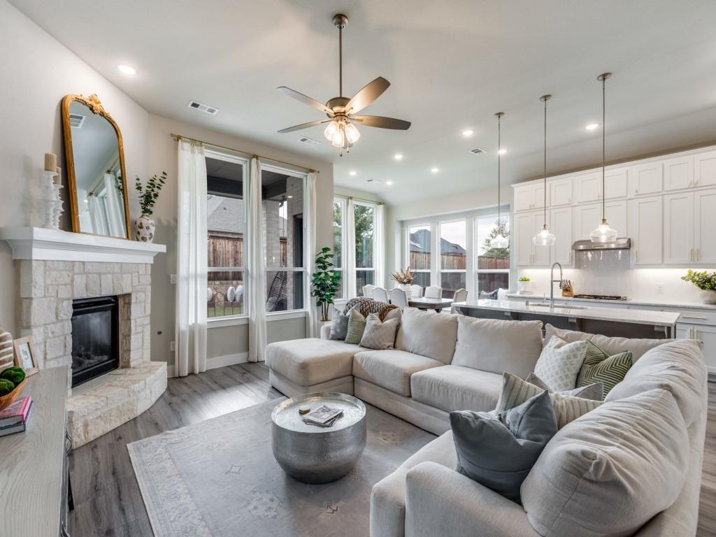 2724 Eccleston Street Celina, TX 75009 - Photo 5 of 29 a living room with furniture and a fireplace