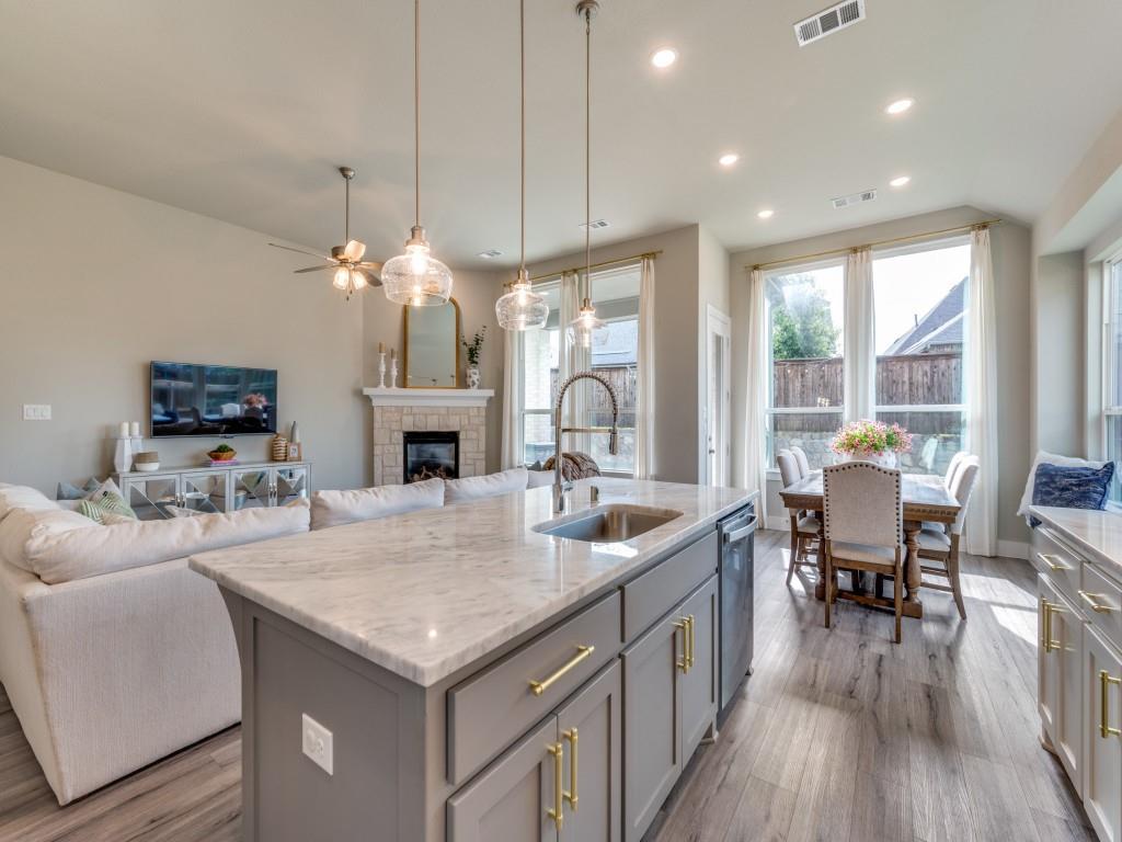 2724 Eccleston Street Celina, TX 75009 - Photo 10 of 29 a open kitchen with sink stove and wooden floor