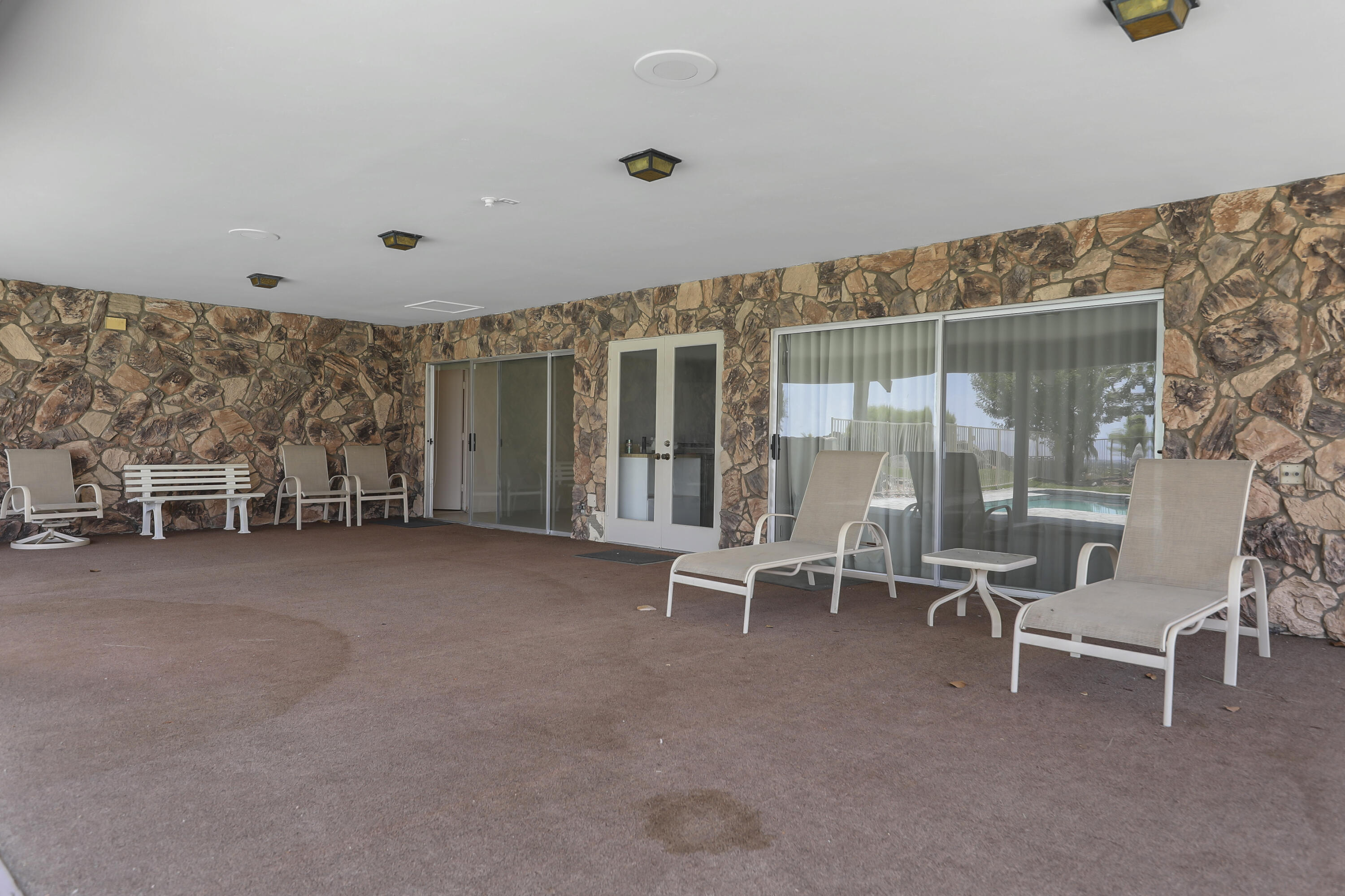 770 South La Mirada Road Palm Springs, CA 92264 - Photo 31 of 39 a view of a livingroom with furniture and floor to ceiling window