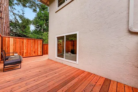a view of outdoor space with wooden floor and furniture