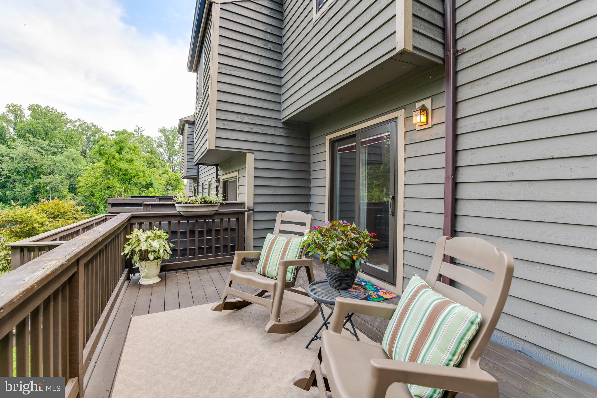 18 Stone Ridge Court, Unit 23 Baltimore, MD 21239 - Photo 12 of 19 a balcony with furniture and a potted plant