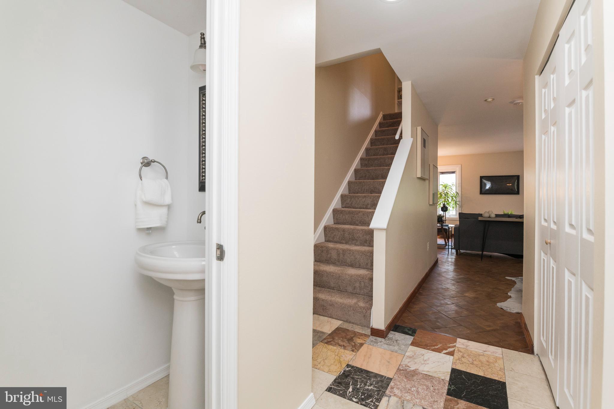 18 Stone Ridge Court, Unit 23 Baltimore, MD 21239 - Photo 7 of 19 a view of entryway and hall with wooden floor