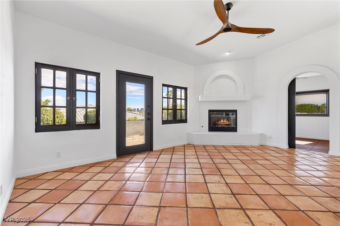 5555 West Desert Inn Road Las Vegas, NV 89146 - Photo 13 of 50 Family room with a fireplace is a perfect space for entertaining!