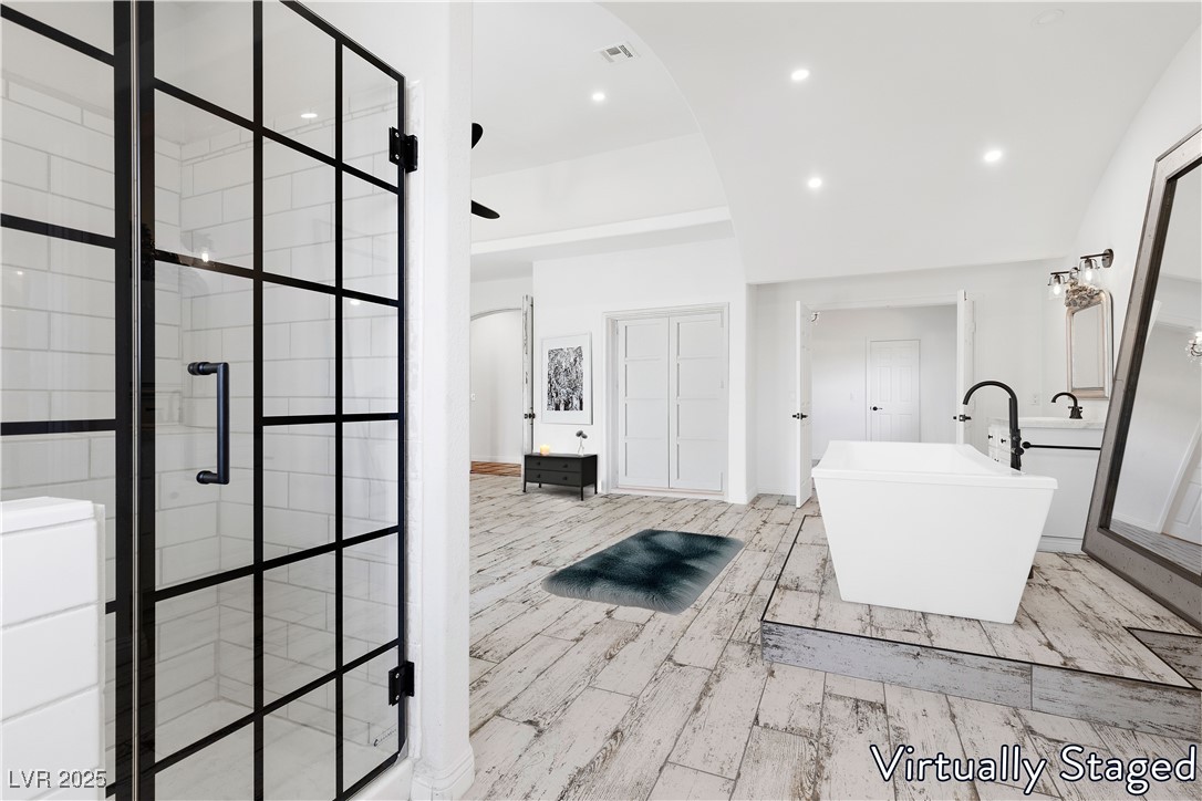 5555 West Desert Inn Road Las Vegas, NV 89146 - Photo 18 of 50 Virtually Staged- Primary bathroom offers a sumptuous soaking tub and a luxurious shower area!