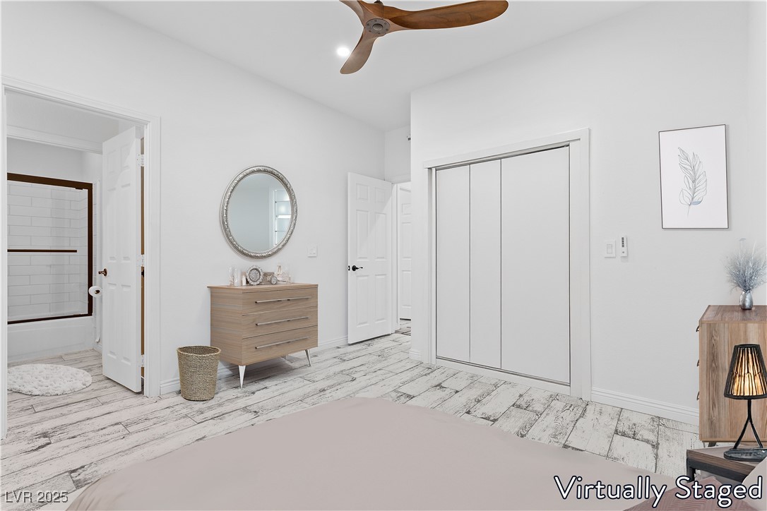 5555 West Desert Inn Road Las Vegas, NV 89146 - Photo 21 of 50 Virtually Staged- Spacious 2nd bedroom features an upgraded ceiling fan and direct access to the full bathroom!
