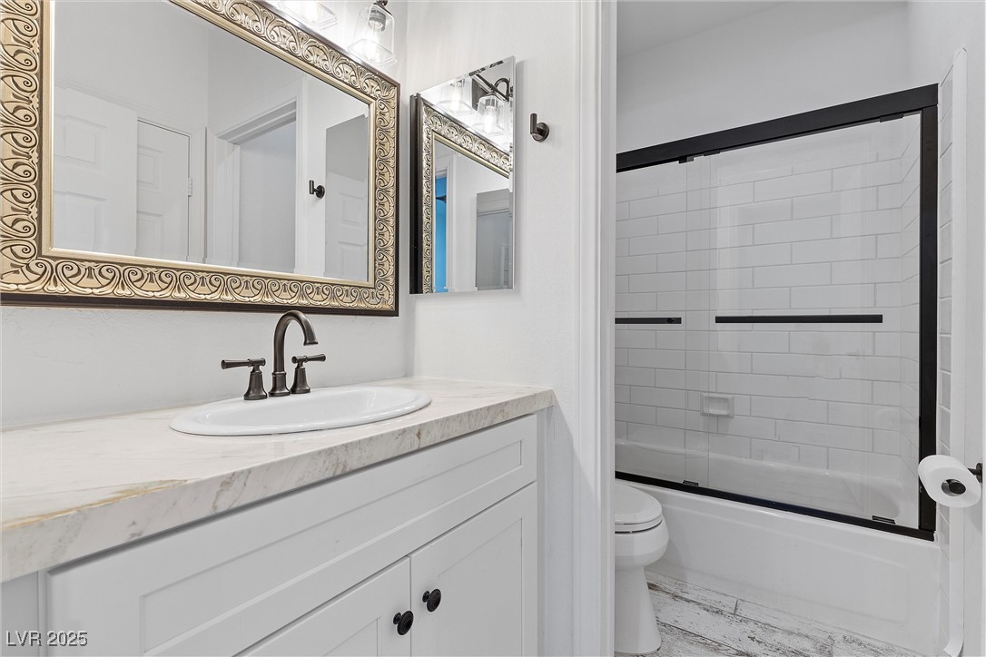 5555 West Desert Inn Road Las Vegas, NV 89146 - Photo 22 of 50 Full bathroom with shower/tub combo and a large vanity mirror!