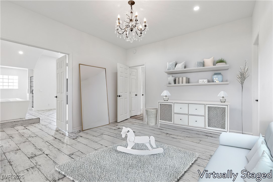 5555 West Desert Inn Road Las Vegas, NV 89146 - Photo 24 of 50 Virtually Staged- 3rd bedroom with walk-in closet and a fabulous chandelier gives a sense of elegance throughout!
