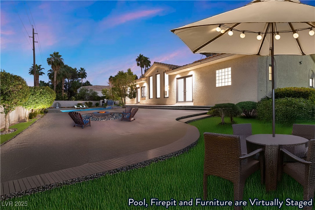 5555 West Desert Inn Road Las Vegas, NV 89146 - Photo 31 of 50 Virtually Staged- The backyard features a patio and desert landscaping!
