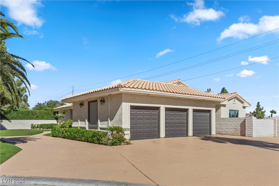 5555 West Desert Inn Road Las Vegas, NV 89146 - Photo 35 of 50 Oversized 3 car garage and spacious driveway features RV parking!