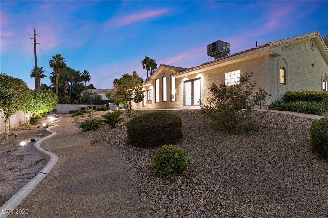 5555 West Desert Inn Road Las Vegas, NV 89146 - Photo 42 of 50 The backyard features a patio and desert landscaping!