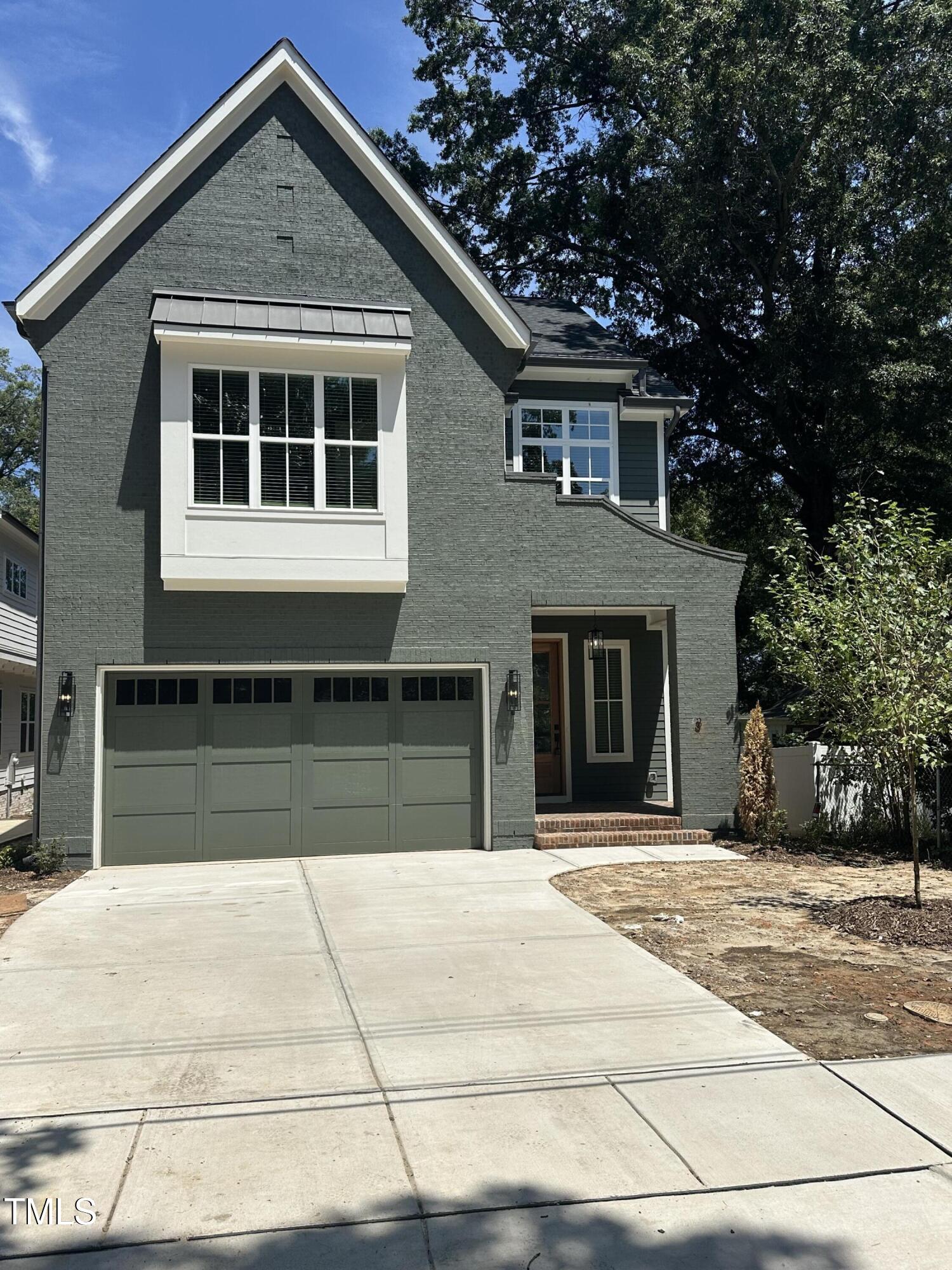 3302 Hall Place Raleigh, NC 27607 - Photo 1 of 25 a front view of a house with a yard