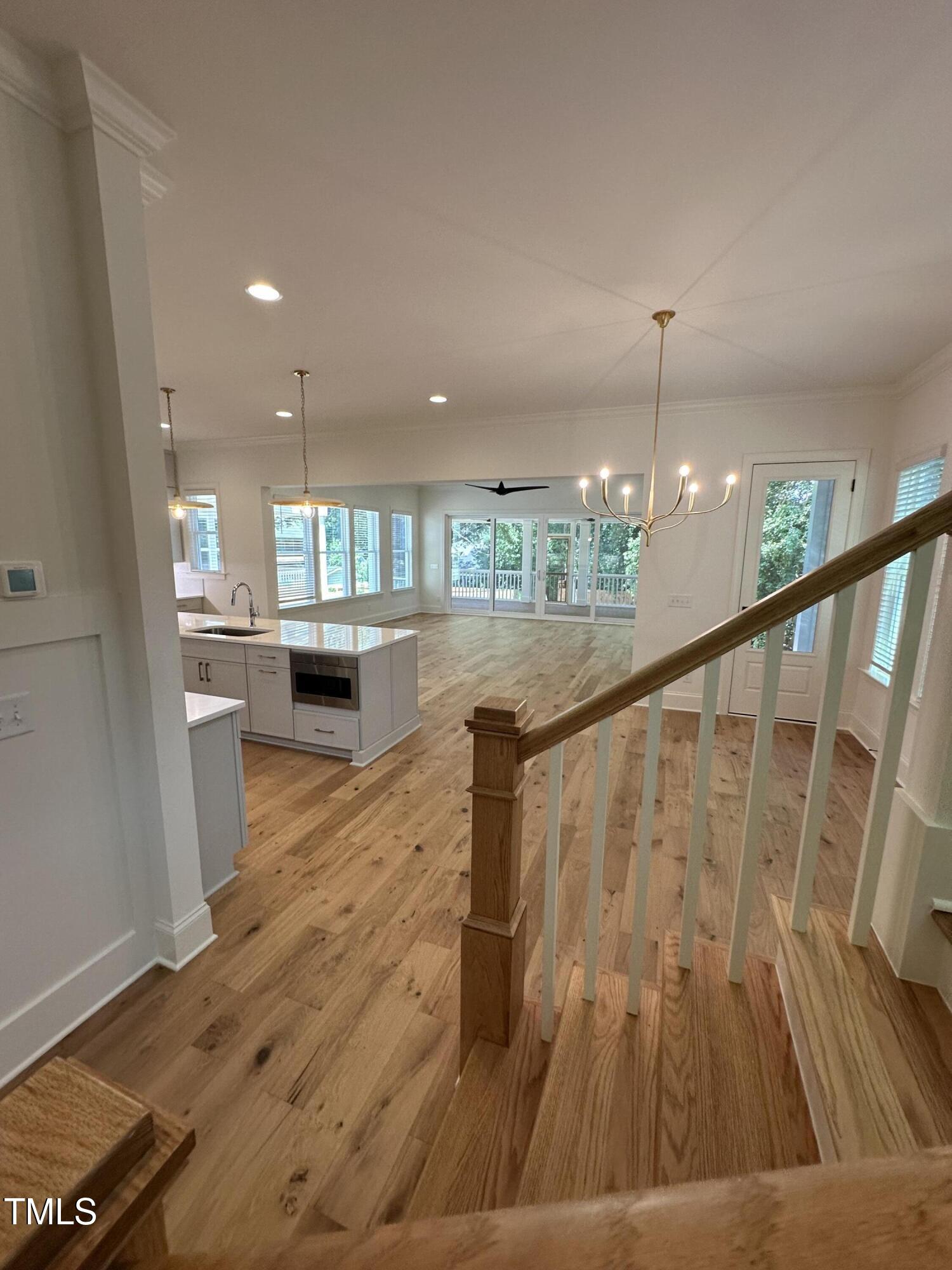 3302 Hall Place Raleigh, NC 27607 - Photo 7 of 25 a view of kitchen and dining room with wooden floor