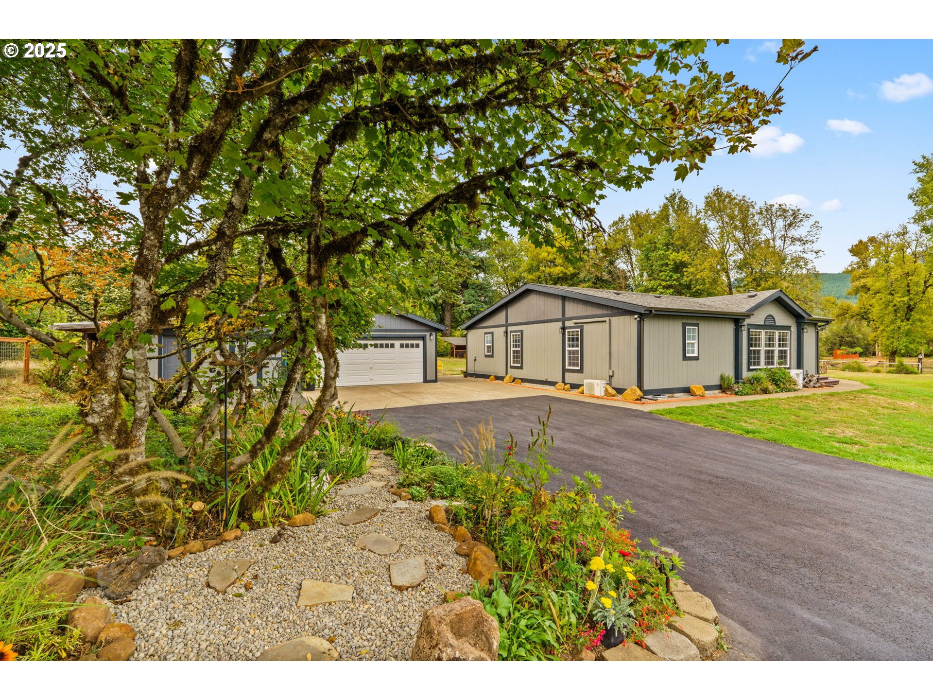 a front view of a house with garden