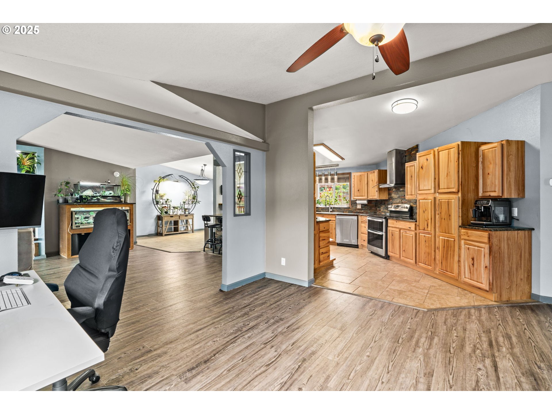 37495 Parsons Creek Road Springfield, OR 97478 - Photo 17 of 47 a view of a living room a refrigerator and wooden floor