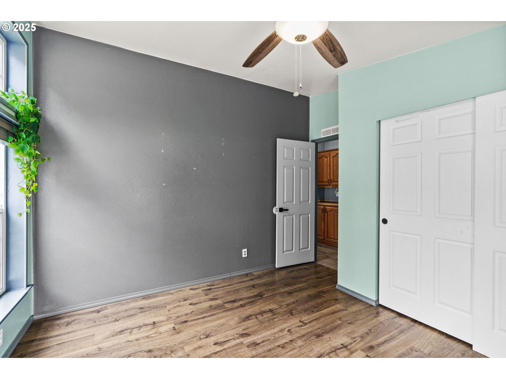 37495 Parsons Creek Road Springfield, OR 97478 - Photo 20 of 47 a view of an empty room with wooden floor and closet