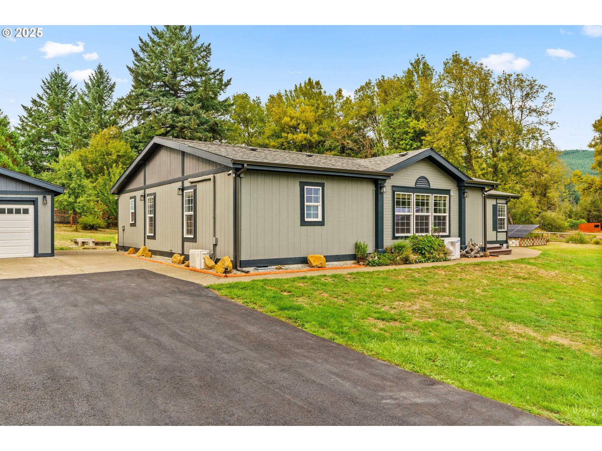 37495 Parsons Creek Road Springfield, OR 97478 - Photo 2 of 47 a front view of a house with a yard