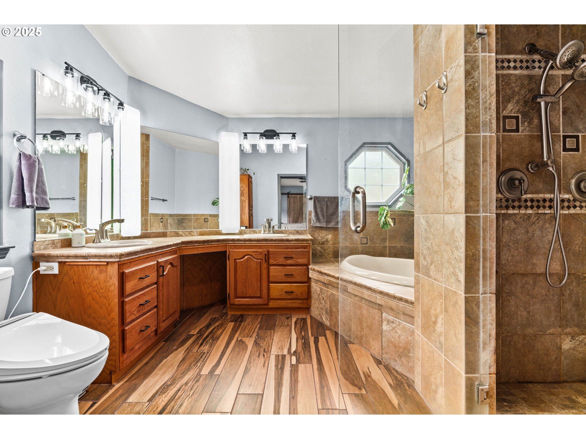 37495 Parsons Creek Road Springfield, OR 97478 - Photo 26 of 47 a large white bathroom with a sink a toilet a mirror and bathtub