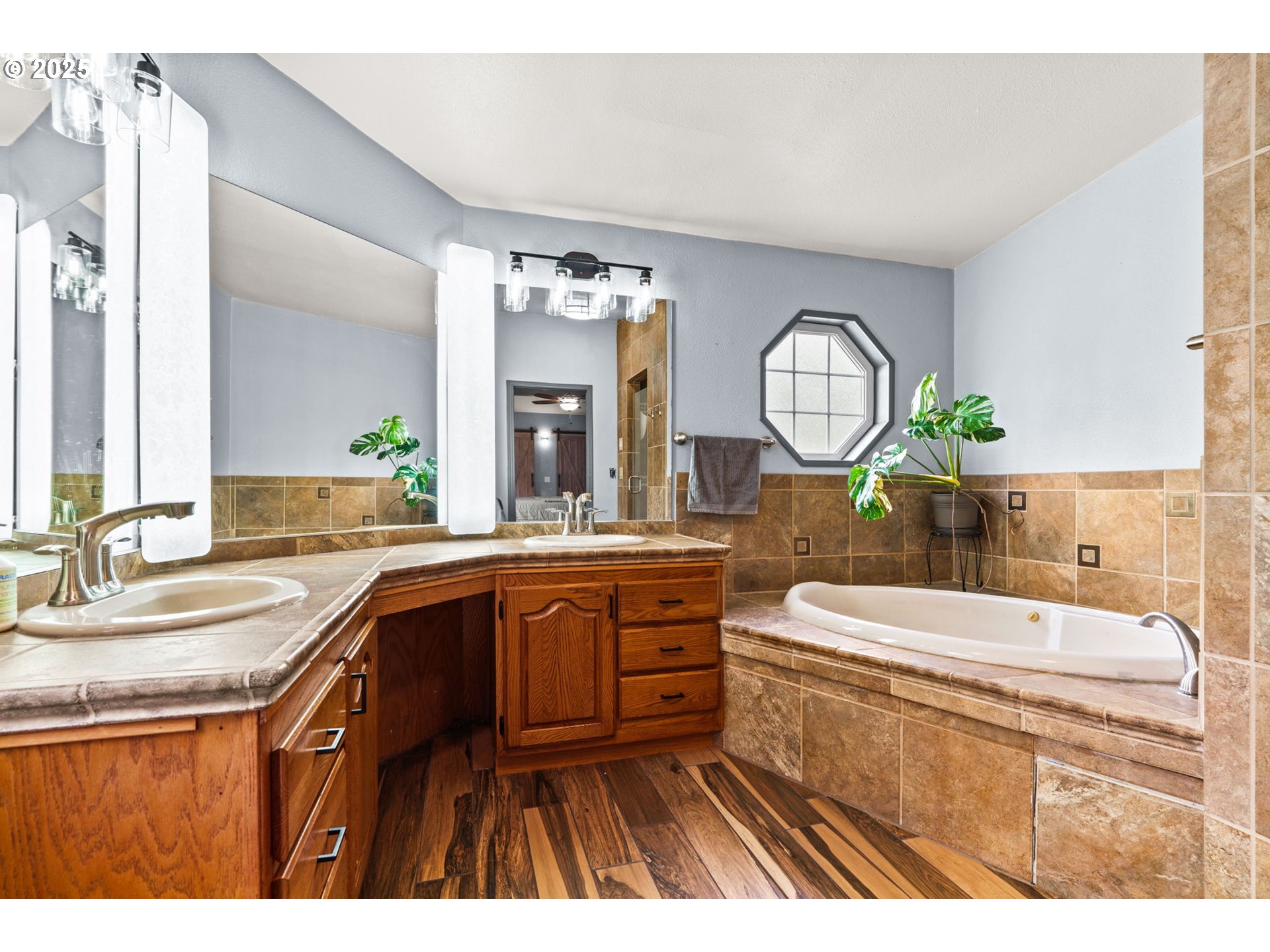 37495 Parsons Creek Road Springfield, OR 97478 - Photo 27 of 47 a bathroom with a sink a vanity a mirror and a toilet