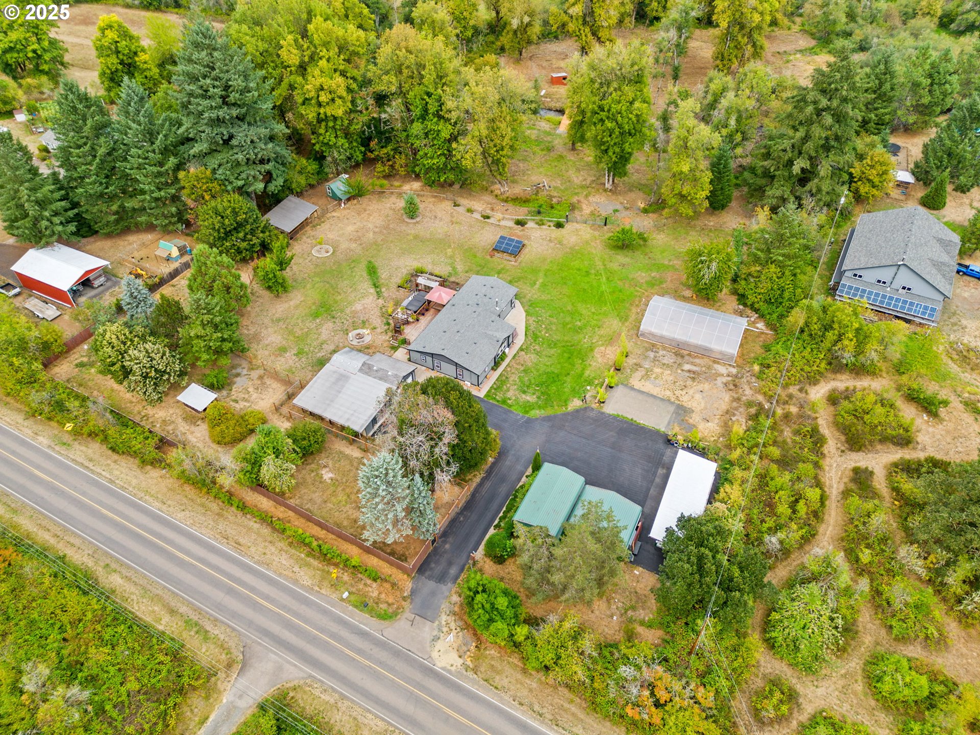 37495 Parsons Creek Road Springfield, OR 97478 - Photo 42 of 47 an aerial view of a house with garden space and street view