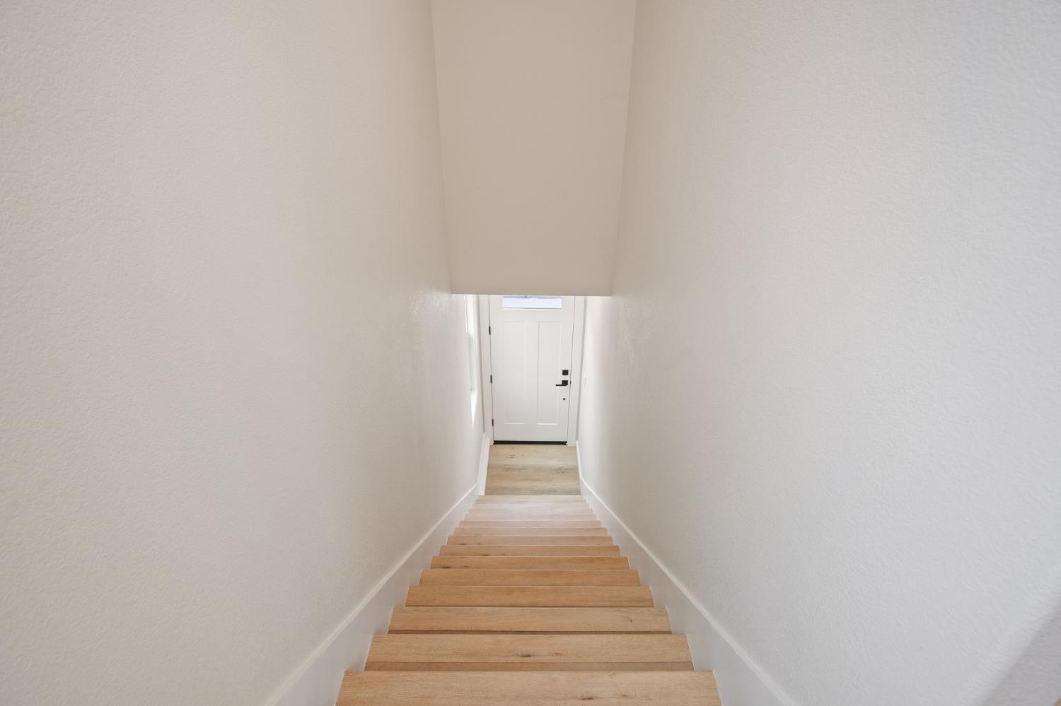 243 East E 3rd Street Tracy, CA 95376 - Photo 18 of 29 a view of a hallway with wooden floor