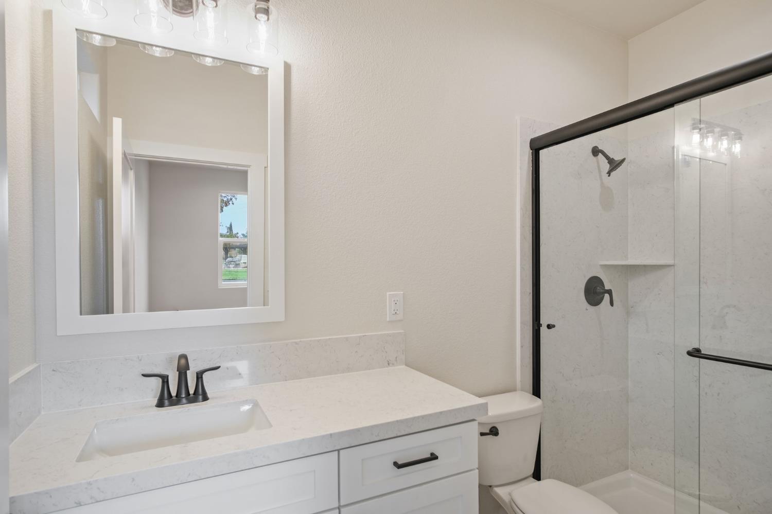 243 East E 3rd Street Tracy, CA 95376 - Photo 19 of 29 a bathroom with a sink and a mirror