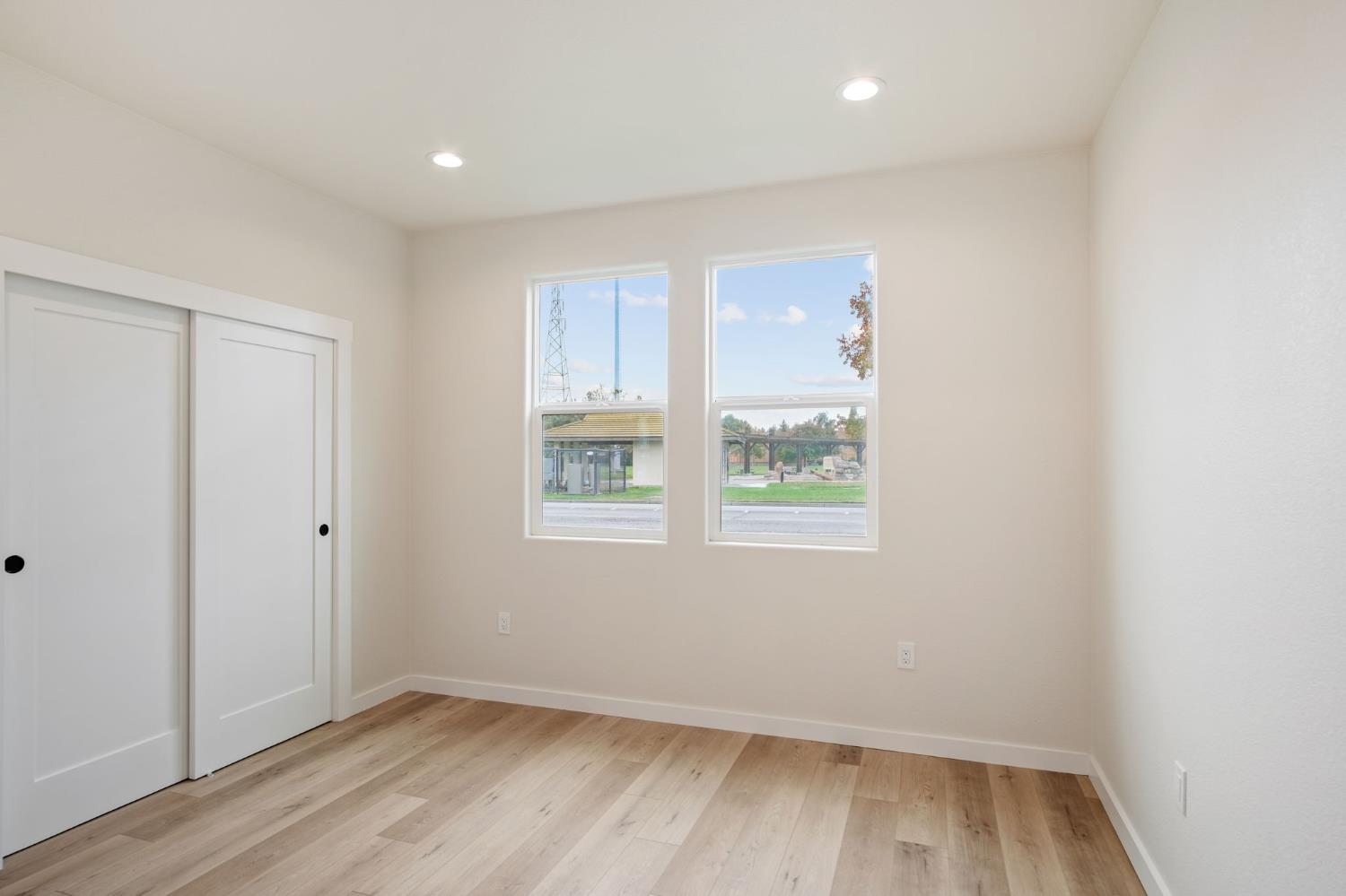 243 East E 3rd Street Tracy, CA 95376 - Photo 20 of 29 a view of room with window and hardwood floor