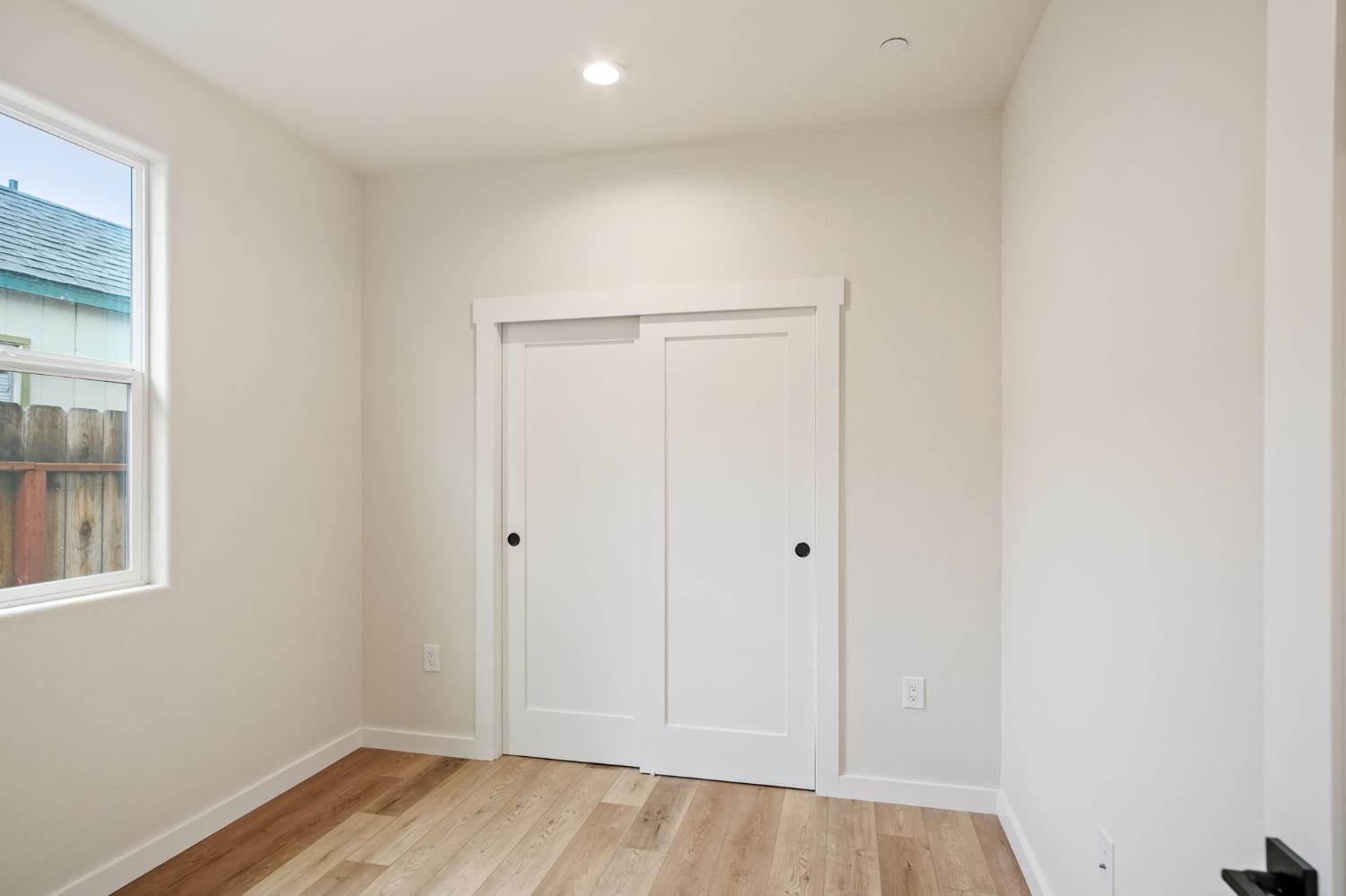 243 East E 3rd Street Tracy, CA 95376 - Photo 22 of 29 wooden floor in an empty room