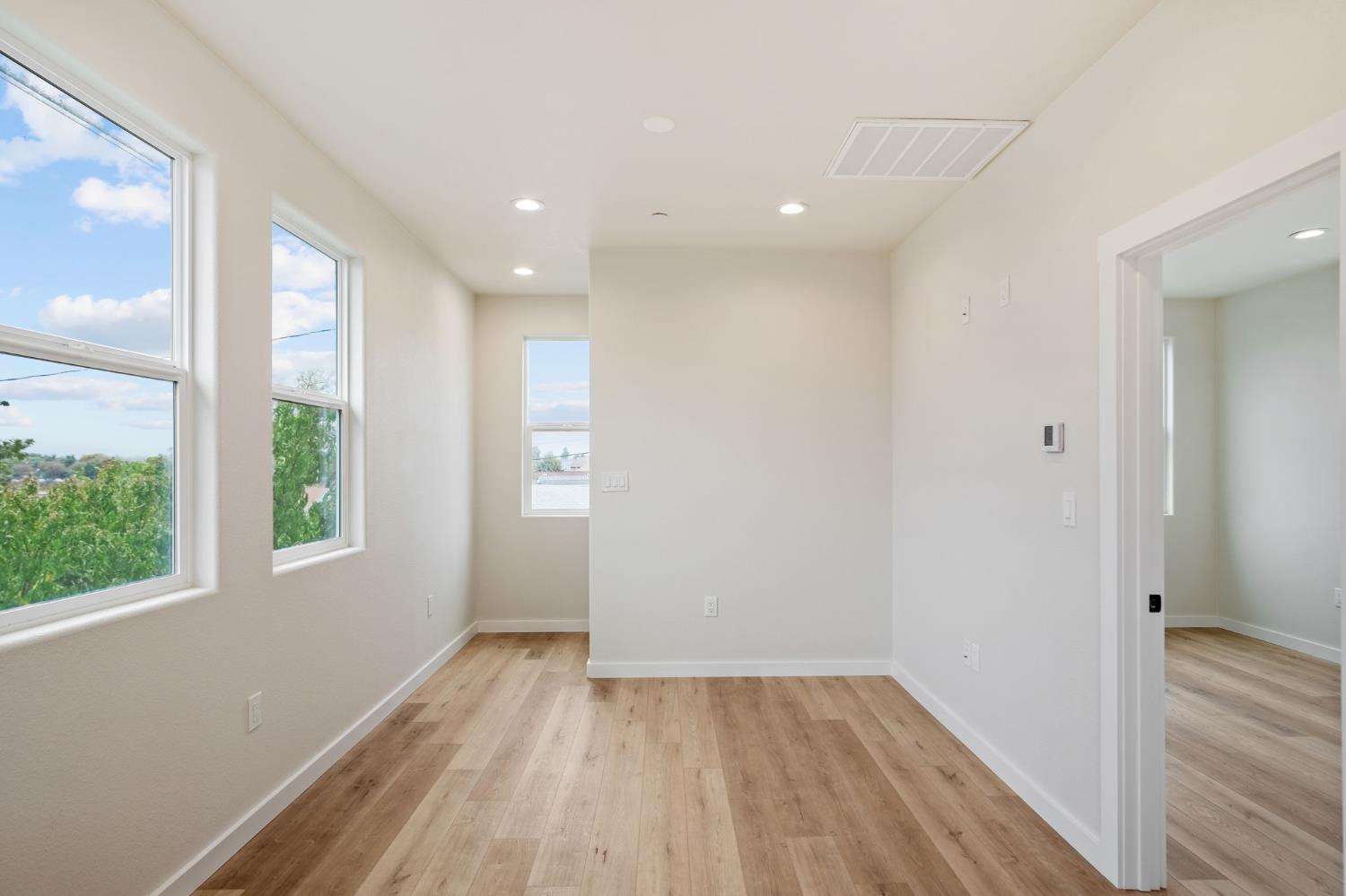 243 East E 3rd Street Tracy, CA 95376 - Photo 10 of 29 a view of a room with wooden floor and window