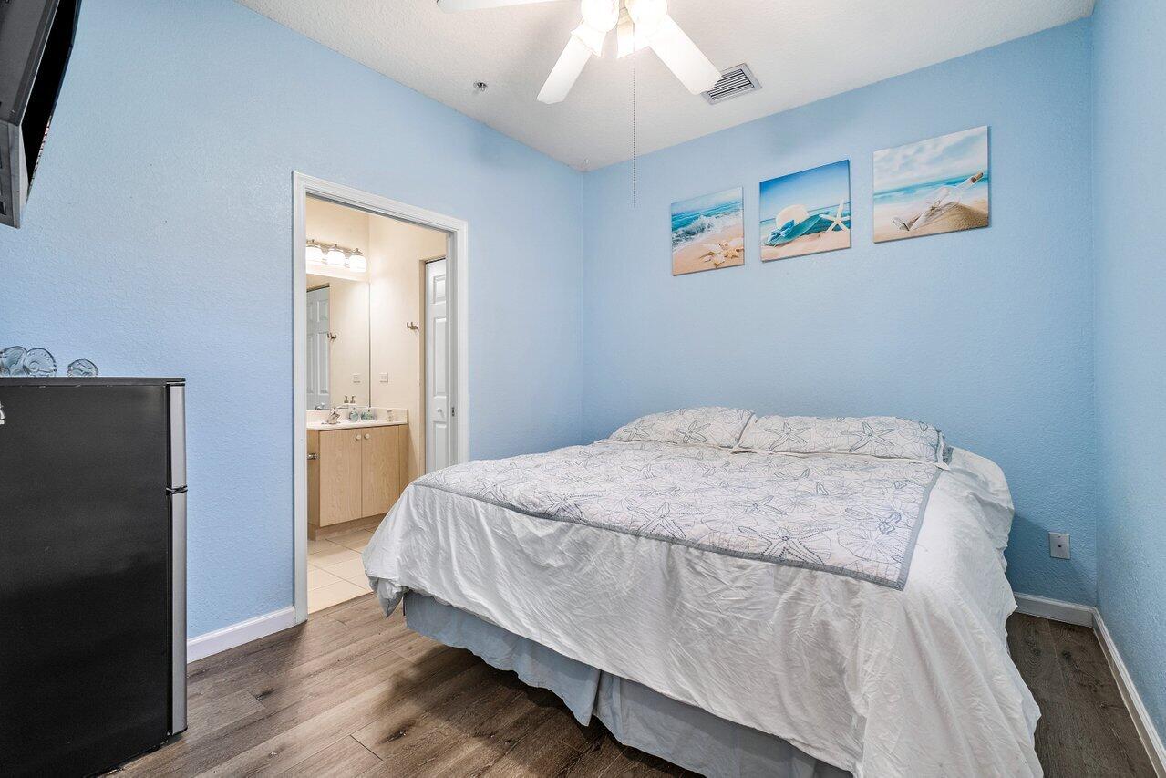 159 Greenwich Circle Jupiter, FL 33458 - Photo 14 of 30 Main Floor Bedroom and Bathroom