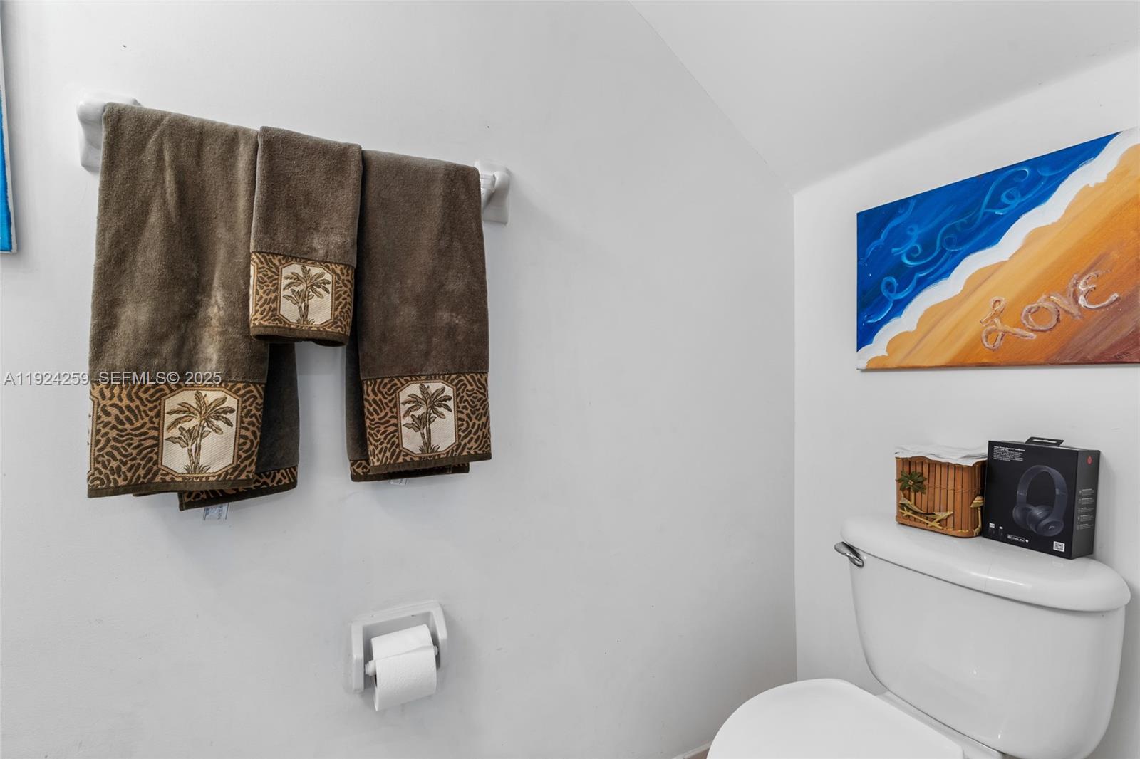 230 Southeast 29th Avenue, Unit 12 Homestead, FL 33033 - Photo 13 of 29 a bathroom with a toilet and a shower curtain