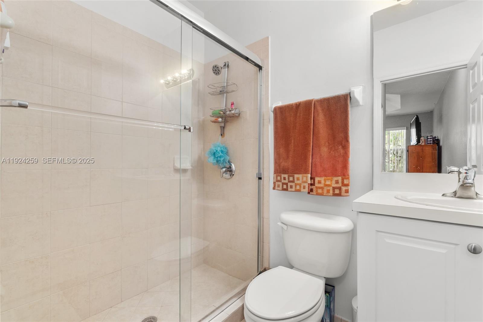 230 Southeast 29th Avenue, Unit 12 Homestead, FL 33033 - Photo 15 of 29 a bathroom with a toilet a sink and shower